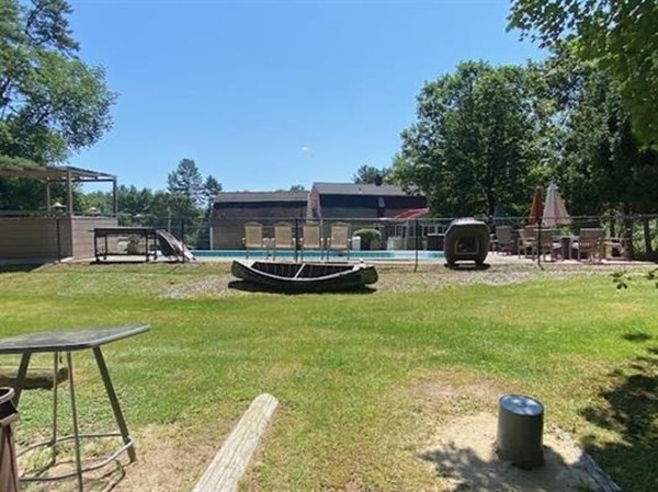 47 South Road Londonderry, NH 03053 - Photo 10 of 39 a house view with swimming pool and sitting space