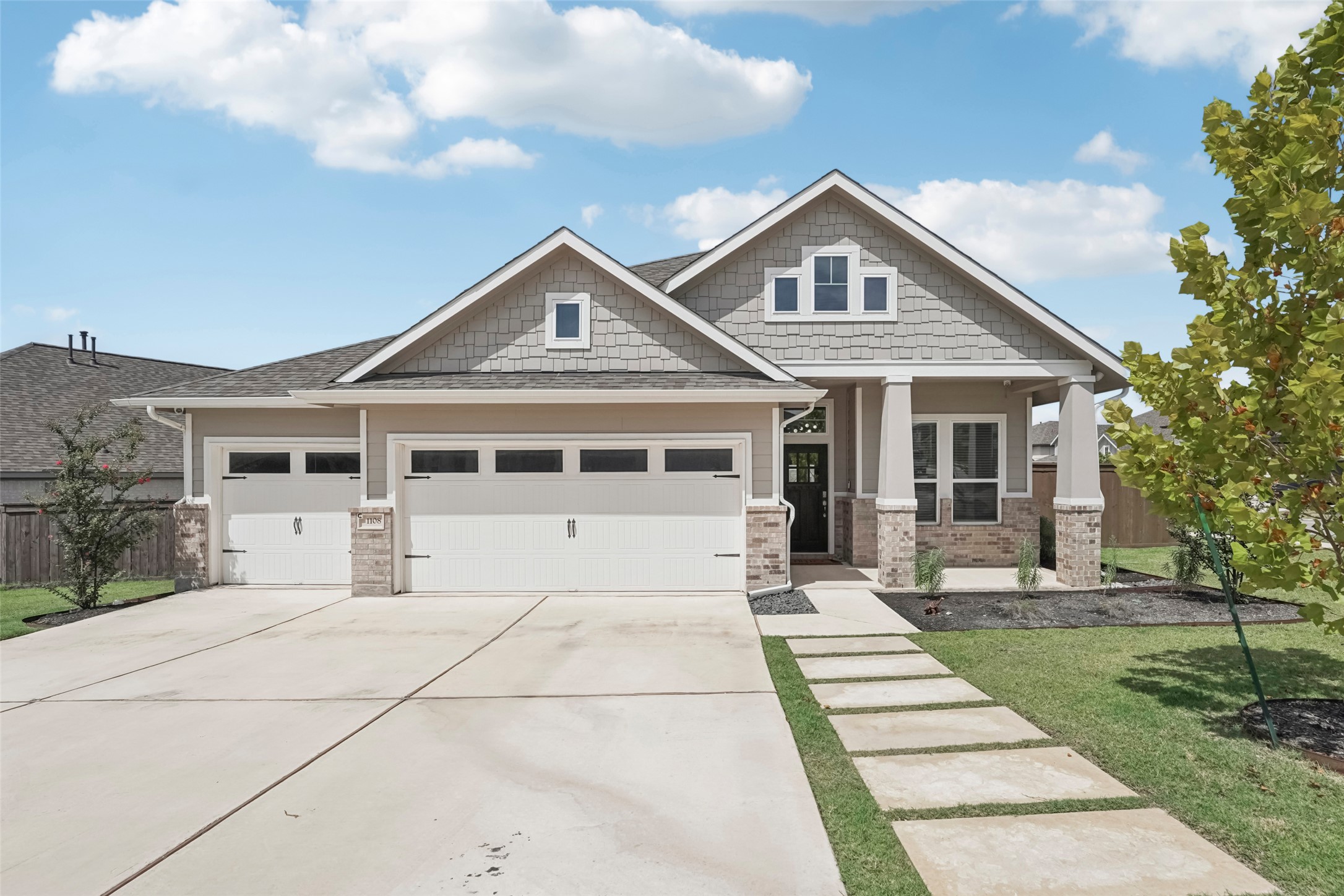 1108 Sweetspire Street Leander, TX 78641 - Photo 1 of 39 Craftsman-style house featuring an attached garage, concrete driveway, and covered porch