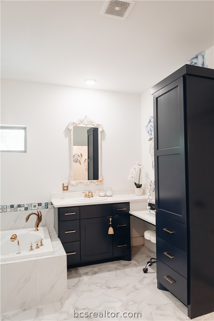 5036 Glory Road Bryan, TX 77808 - Photo 23 of 50 Custom tile and cabinets through-out bathroom