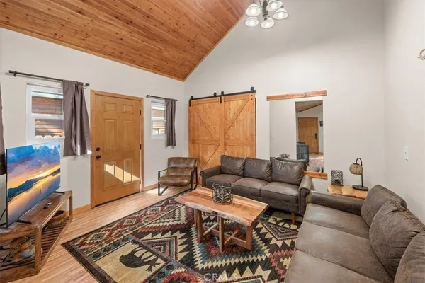 a living room with furniture and a rug