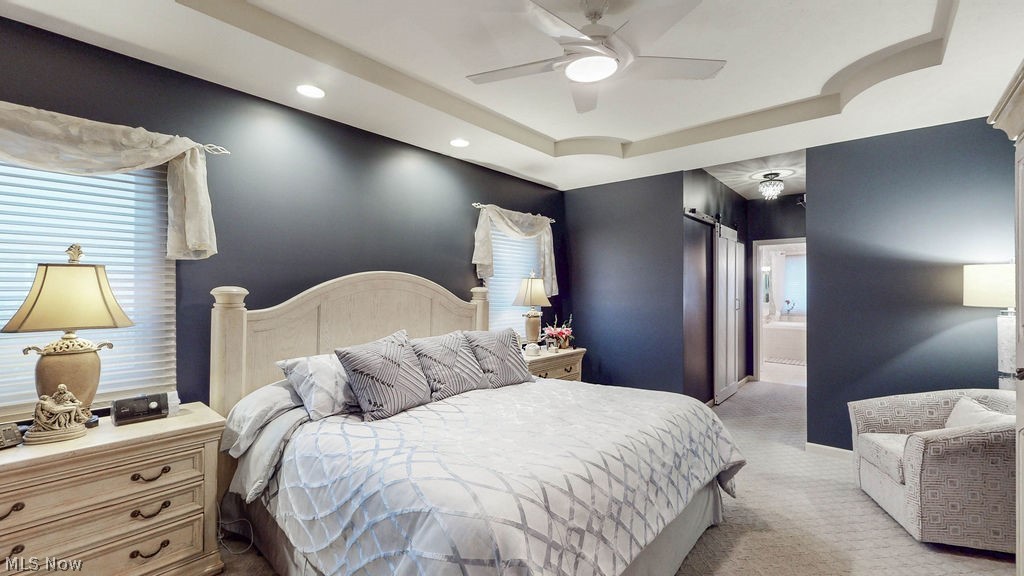 36845 Aberdeen Lane Solon, OH 44139 - Photo 12 of 24 Master Bedroom with a raised ceiling, ceiling fan, carpet floors, connected bathroom, and recessed lighting