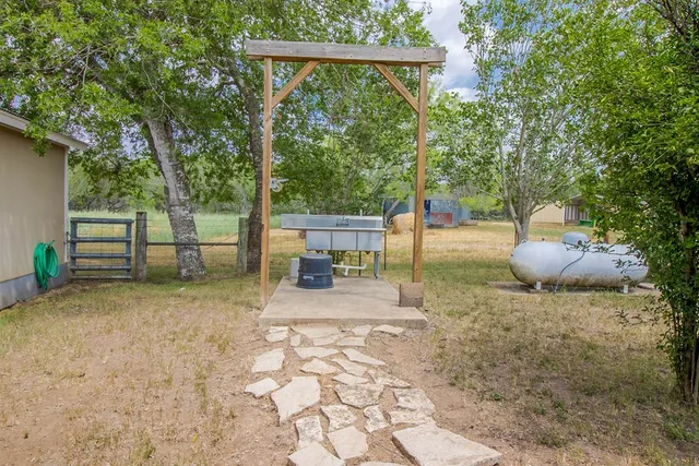 a backyard of a house with seating space