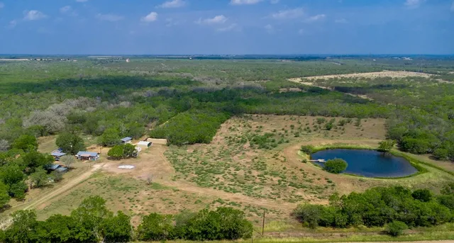 a view of a lake with a yard