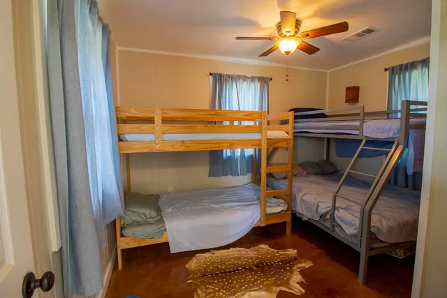 a bedroom with furniture and a window