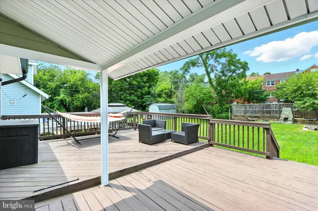 a view of a patio with wooden floor