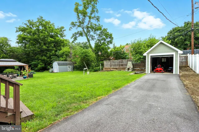 a view of a house with backyard and a slide