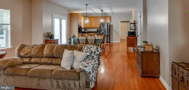 a view of a dining room with furniture and wooden floor