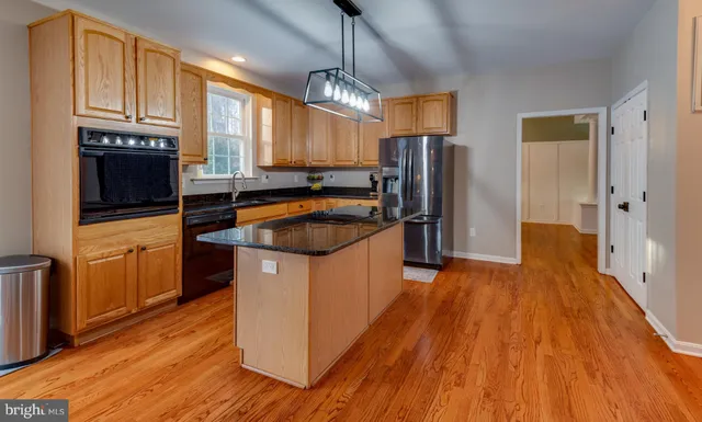 a bedroom with a bed and a mirror