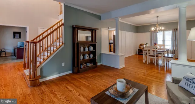 a bedroom with furniture and a wooden floor
