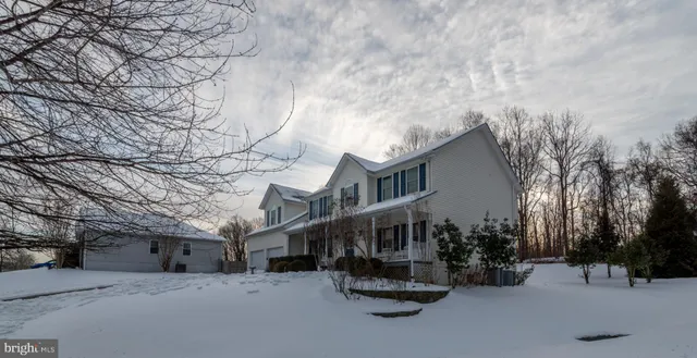 a kitchen with stainless steel appliances granite countertop a refrigerator a stove a sink and dishwasher