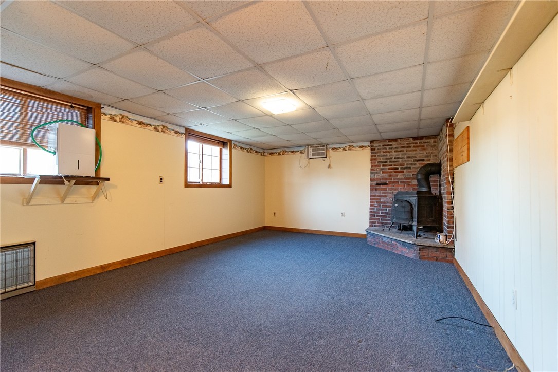 24 Cove Road Westerly, RI 02891 - Photo 35 of 42 Lower level family room with wood stove