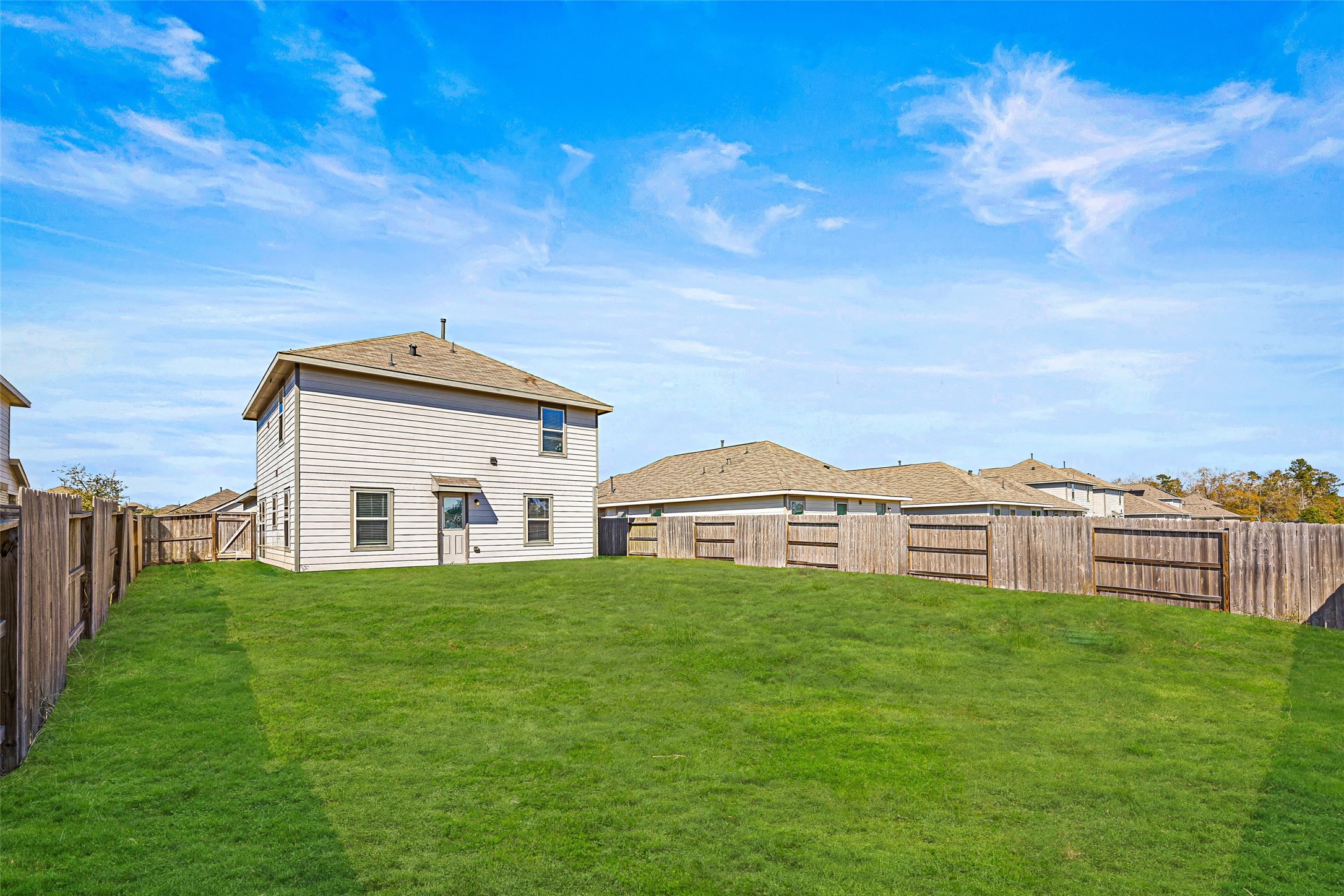5976 Rimini Landing Lane Porter, TX 77365 - Photo 18 of 18 a white house with a big yard and large trees