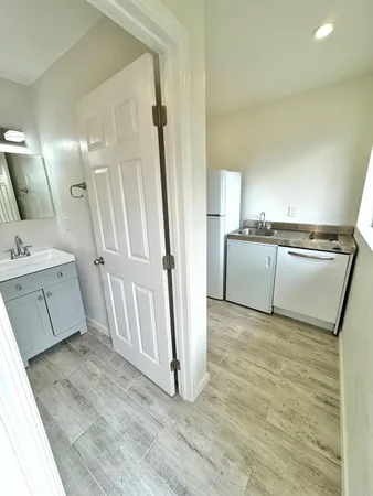 a view of a kitchen with a sink cabinets and a window