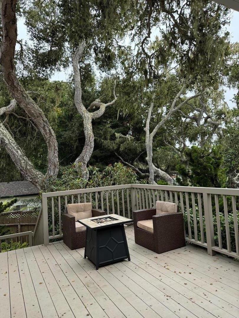 Hermitage Road Pebble Beach, CA 93953 - Photo 10 of 10 a view of a deck with couches wooden floor and fence
