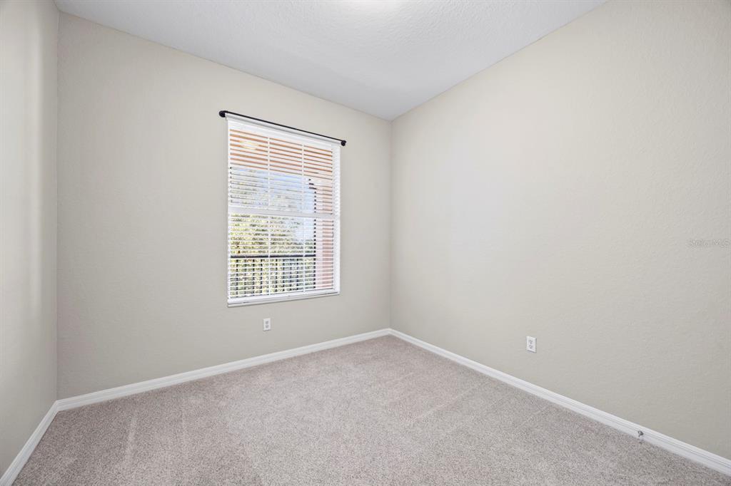1355 Venezia Court, Unit 405 Davenport, FL 33896 - Photo 11 of 30 an empty room with a window
