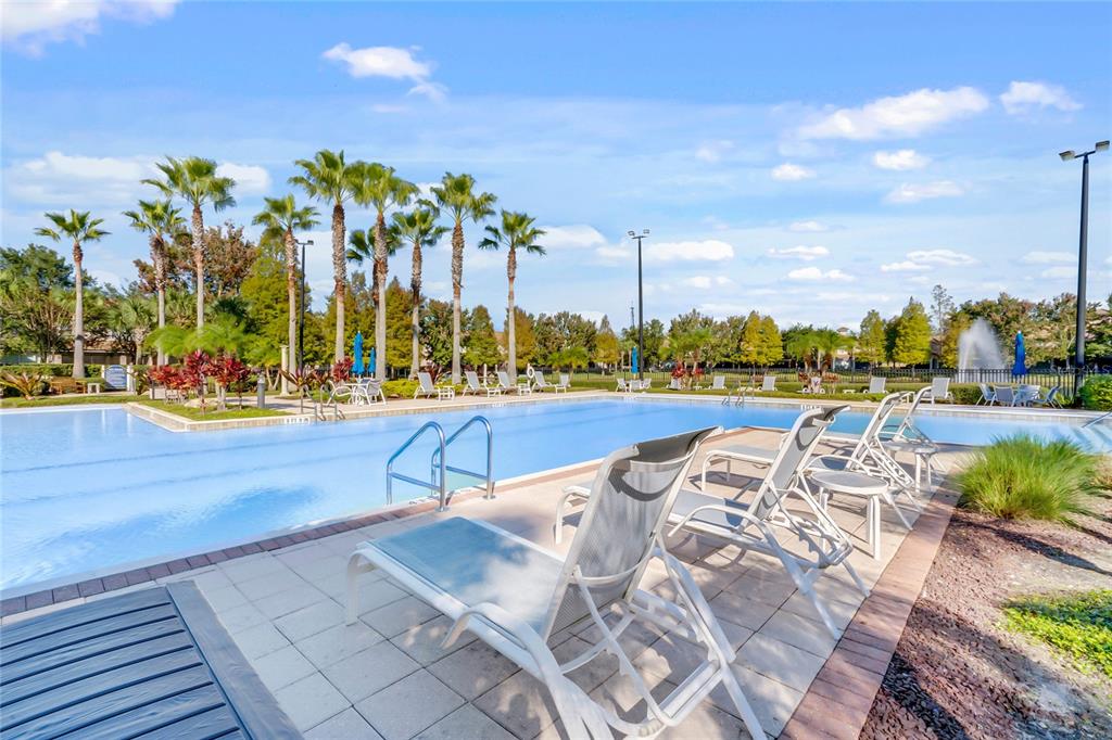 1355 Venezia Court, Unit 405 Davenport, FL 33896 - Photo 20 of 30 a view of swimming pool with outdoor seating