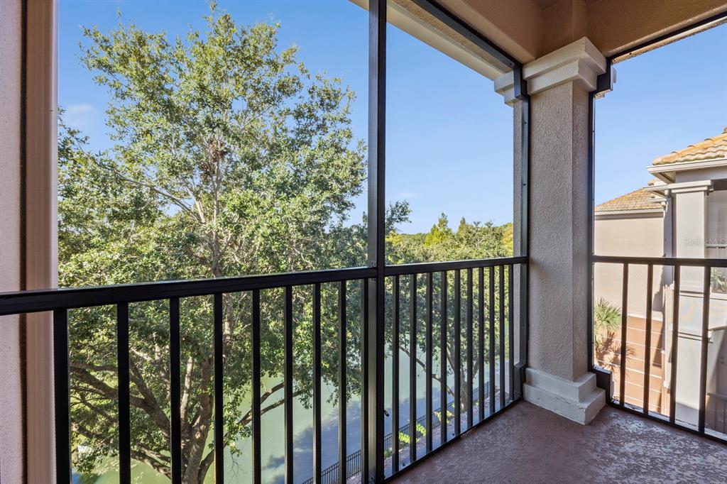 1355 Venezia Court, Unit 405 Davenport, FL 33896 - Photo 3 of 30 a view of a balcony with wooden floor