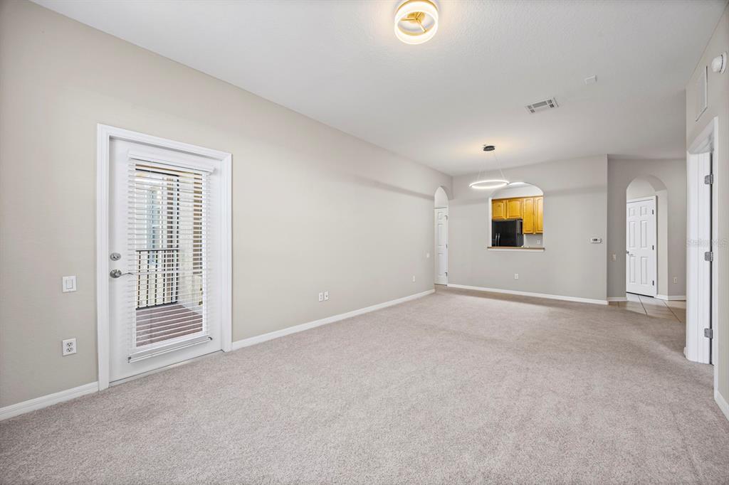 1355 Venezia Court, Unit 405 Davenport, FL 33896 - Photo 4 of 30 a view of an empty room with a window