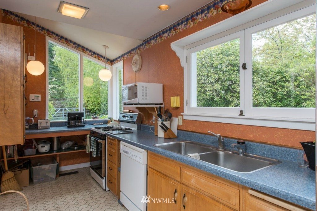 18624 Beall Road Southwest Vashon, WA 98070 - Photo 12 of 25 a kitchen with a sink and large window