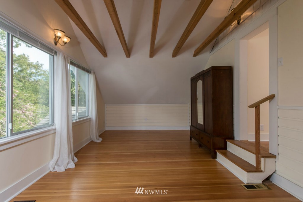 18624 Beall Road Southwest Vashon, WA 98070 - Photo 16 of 25 a view of hallway with stairs and wooden floor