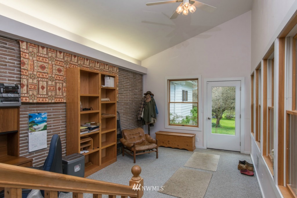 18624 Beall Road Southwest Vashon, WA 98070 - Photo 18 of 25 a living room with furniture and a window