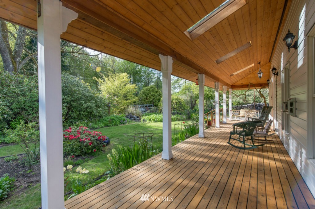 18624 Beall Road Southwest Vashon, WA 98070 - Photo 19 of 25 a house view with a seating space and garden view