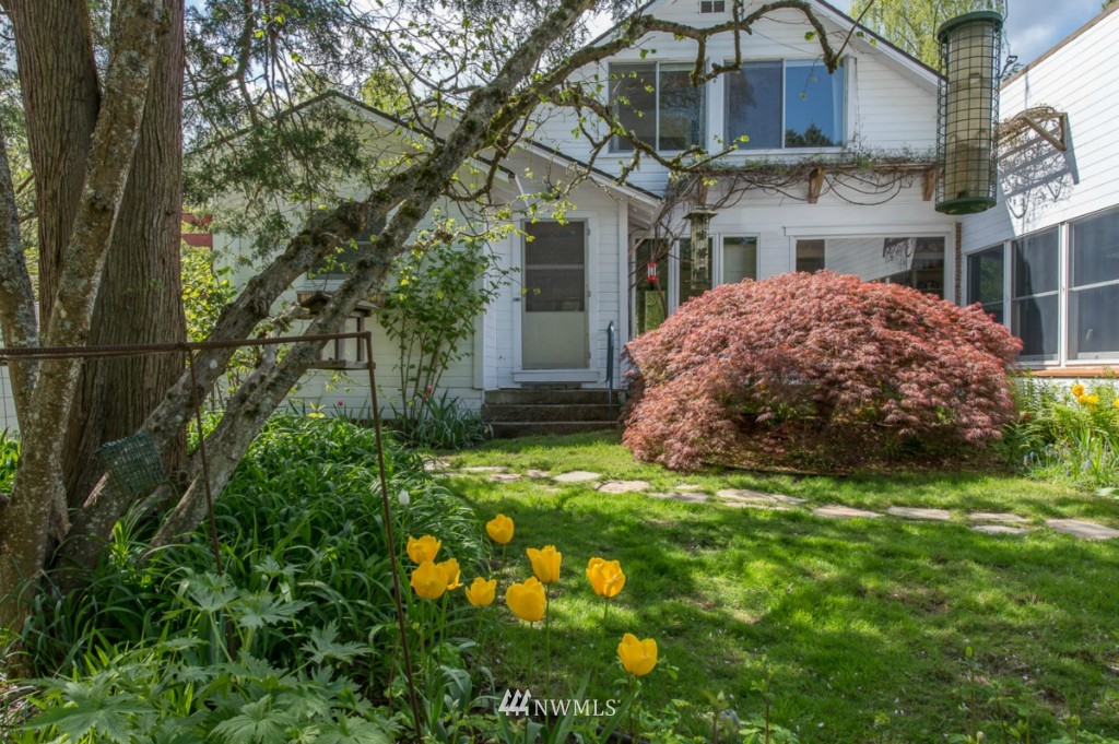 18624 Beall Road Southwest Vashon, WA 98070 - Photo 22 of 25 a view of a house with a garden