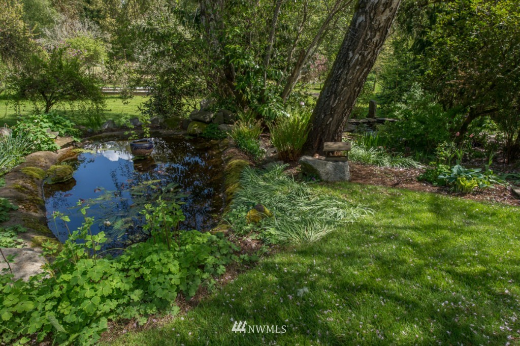 18624 Beall Road Southwest Vashon, WA 98070 - Photo 23 of 25 a view of a lake with a tree