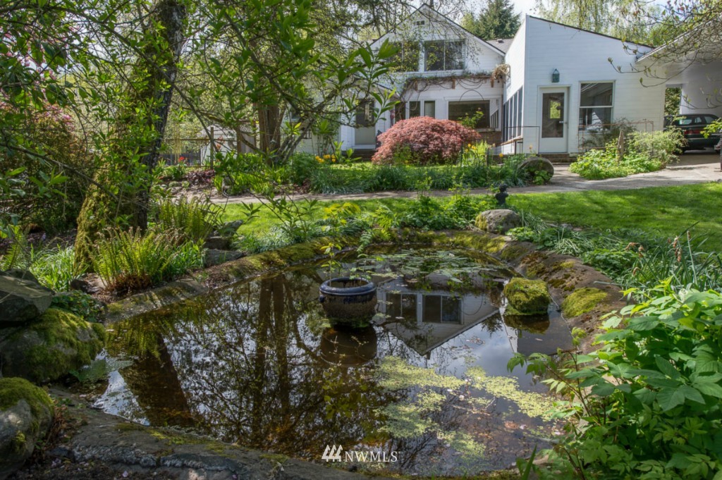 18624 Beall Road Southwest Vashon, WA 98070 - Photo 24 of 25 a view of a house with a yard and plants