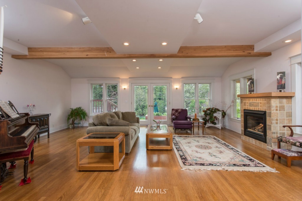 18624 Beall Road Southwest Vashon, WA 98070 - Photo 6 of 25 a living room with furniture and a fireplace