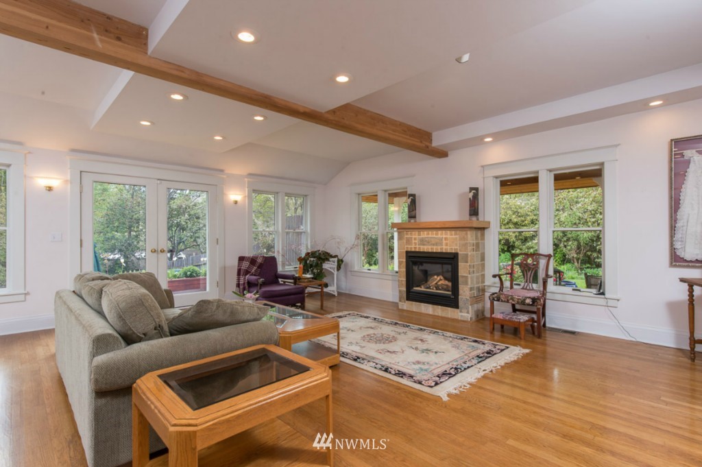 18624 Beall Road Southwest Vashon, WA 98070 - Photo 7 of 25 a living room with furniture and a fireplace