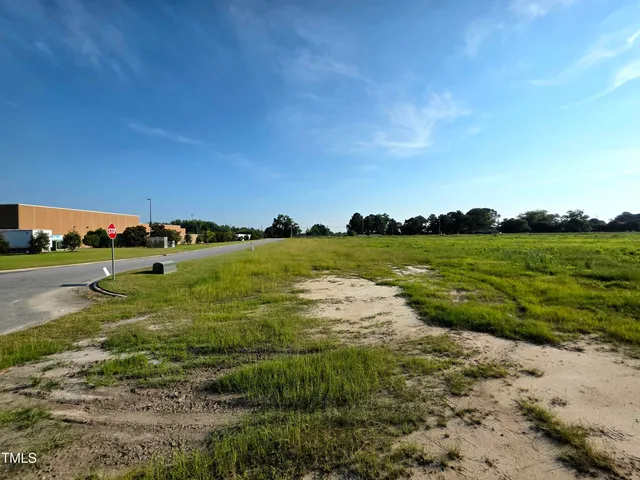 a view of a lake with green space