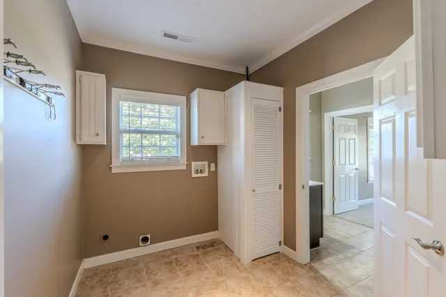a view of room with window and hallway view