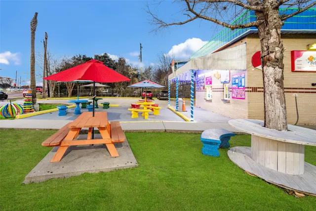 an outdoor space with lots of swings and slides