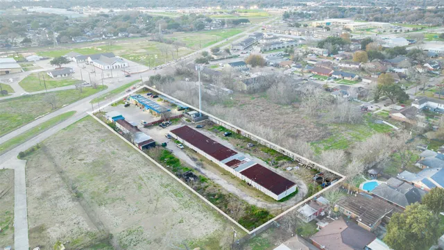 an aerial view of a house with a swimming pool