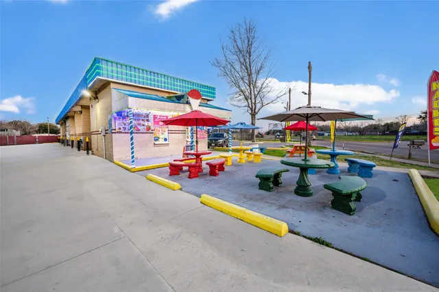 a view of a park with swings and slides