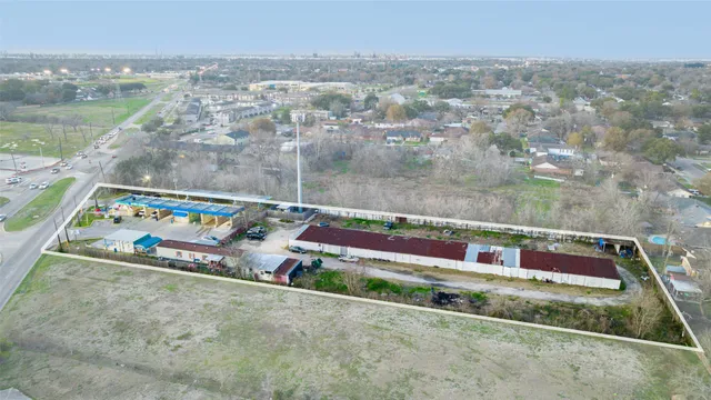 a view of a backyard with sitting area