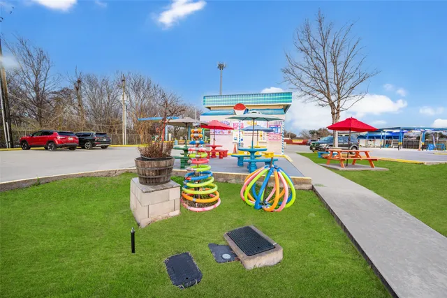 a view of a building with car parked