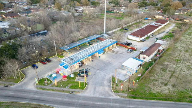 an aerial view of residential houses with outdoor space