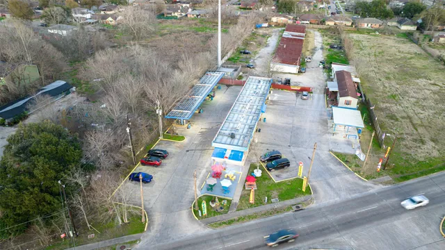 an aerial view of residential houses with outdoor space
