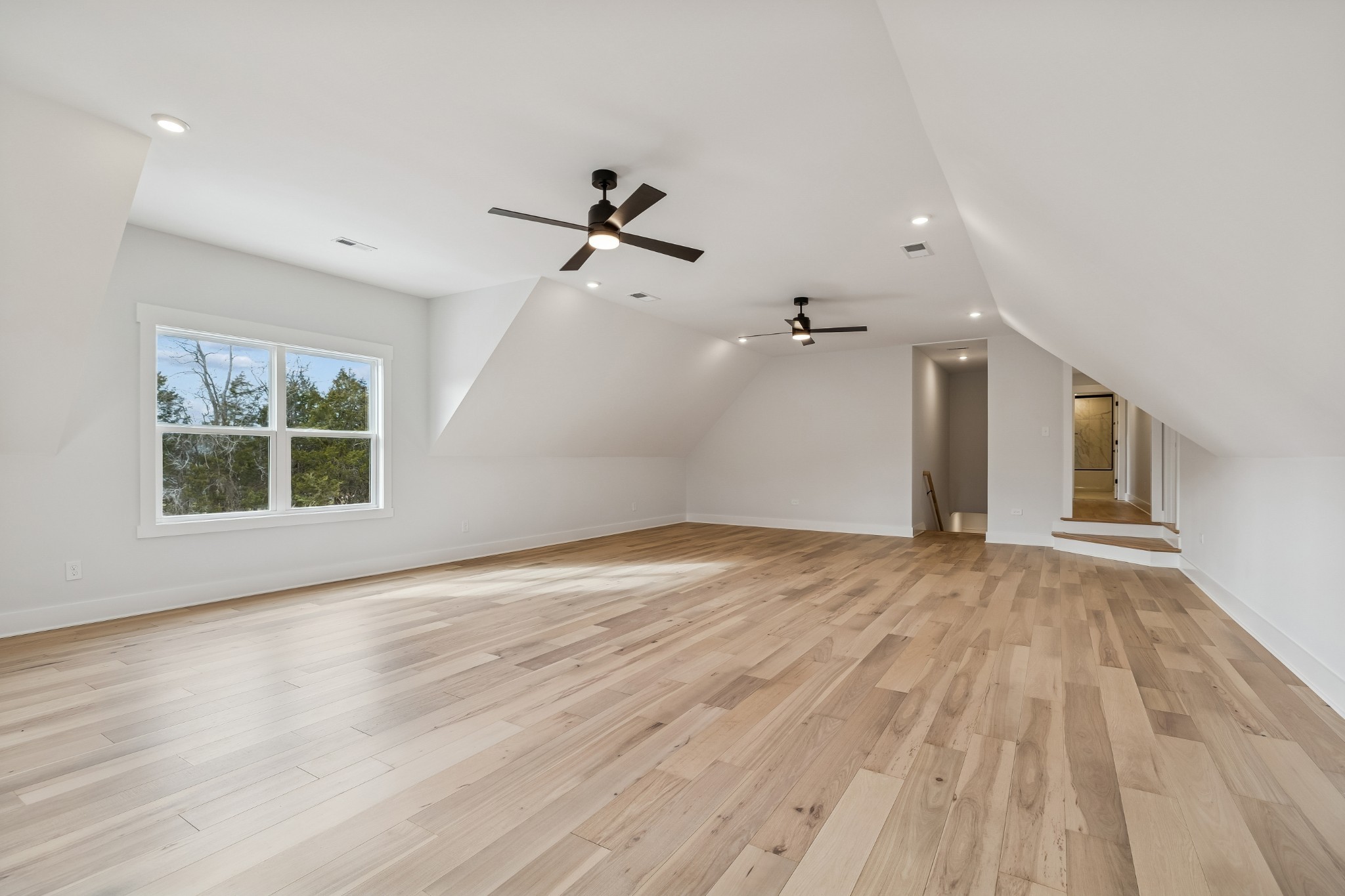 9665 McKee Road Lascassas, TN 37085 - Photo 56 of 73 a view of empty room with wooden floor and fan