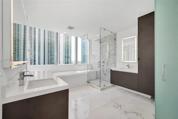 a bathroom with a bathtub and a sink