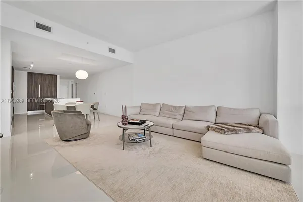 a living room with furniture and a couch