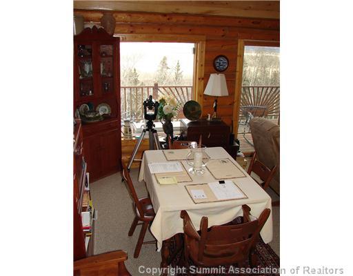 317 Sheep Ridge Road Fairplay, CO 80440 - Photo 5 of 12 a view of a dining room with furniture and window
