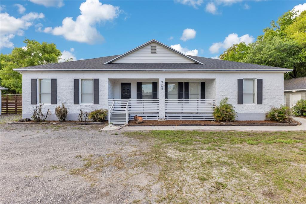 704 Grape Avenue St. Cloud, FL 34769 - Photo 1 of 30 a front view of a house with yard