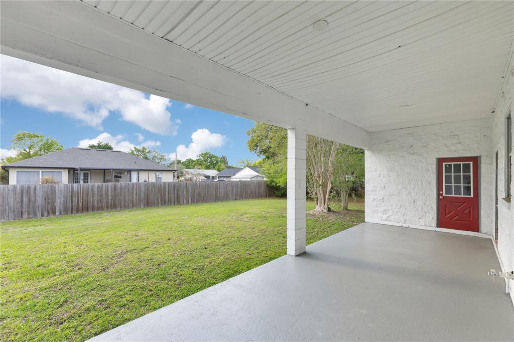 704 Grape Avenue St. Cloud, FL 34769 - Photo 13 of 30 a view of a backyard with a garden