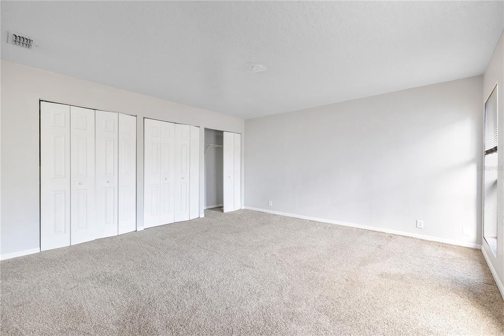 704 Grape Avenue St. Cloud, FL 34769 - Photo 18 of 30 a view of an empty room and a window