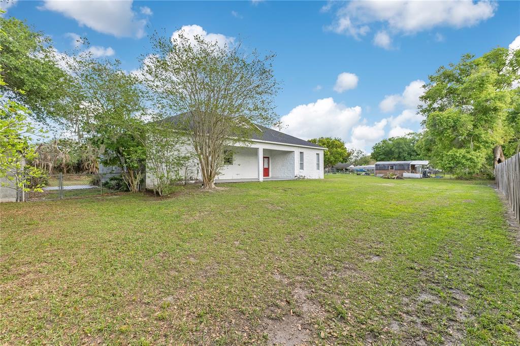 704 Grape Avenue St. Cloud, FL 34769 - Photo 21 of 30 a view of a house with a yard
