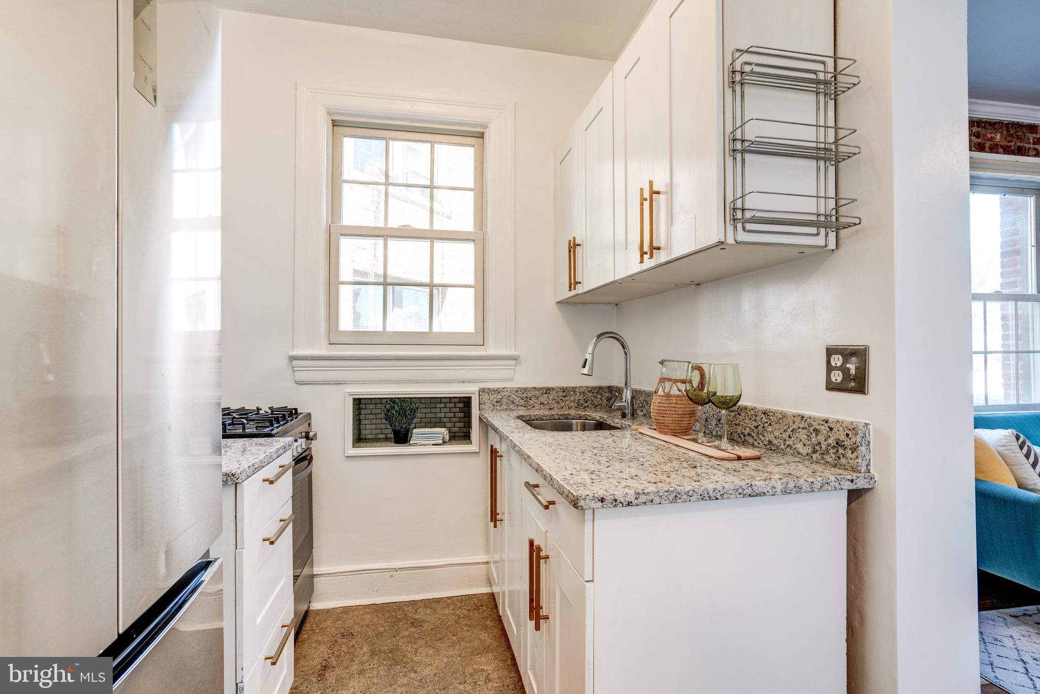 2707 Adams Mill Road Northwest, Unit 408 Washington, DC 20009 - Photo 8 of 21 Light filled kitchen
