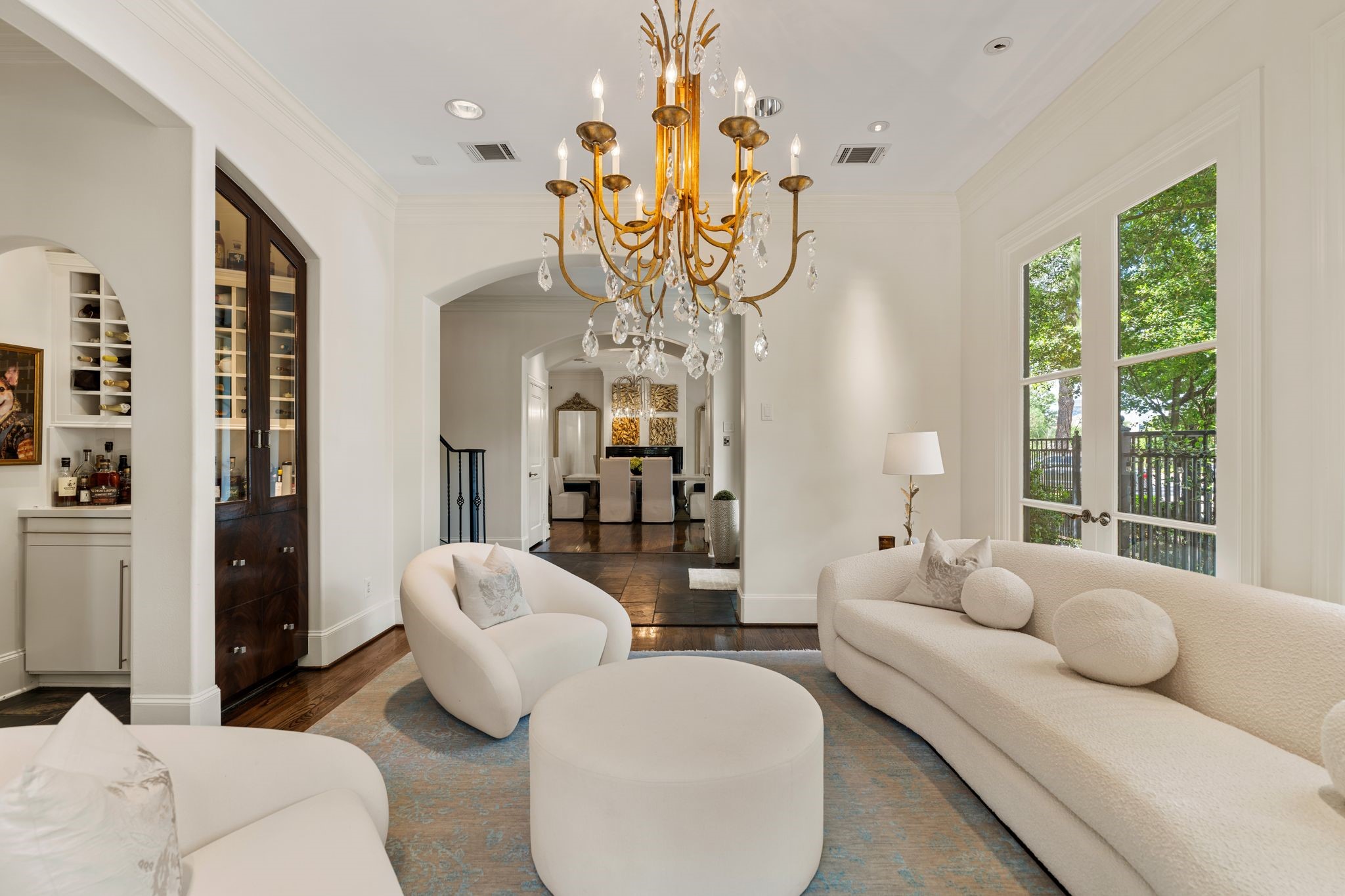 30 Hackberry Lane, Unit A Houston, TX 77027 - Photo 11 of 42 A custom built-in cabinet with glass doors and display shelving provides both functionality and a refined showcase for art, decor and a bottle collection through the adjoining dry bar.